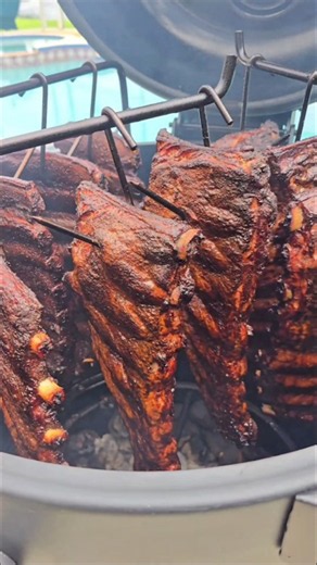 Hanging ribs inside a drum smoker