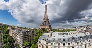 Eiffel Tower, elevated aerial view over rooftops, Paris, France, Europe - Time lapse
