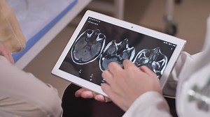 Doctor showing scan results on a tablet - Free Stock Video