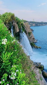 View of the Nizhny Duden waterfalls in Antalya, Turkey. Waterfalls fall from a rocky cliff into the Mediterranean Sea. The cascade is formed by the Duden River, one of the rivers in southern Anatolia.