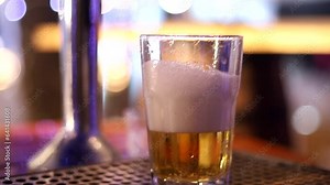 hand pouring draught beer into a glass how to pour the perfect Draught beer into a glass