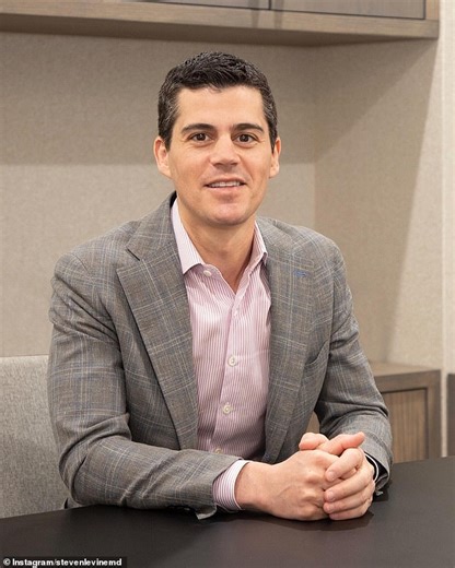 Kris Jenner poses with her plastic at her milestone birthday bash