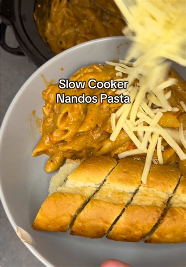 Nandos Chicken Pasta Full recipe below I literally make this once a week because it’s so good 😍 Diced chicken Red onion Red pepper Paprika Garlic 250g Nandos Lemon and Herb Sauce 1 tbsp tomato puree 1 tsp paprika 1 tsp garlic granules 1 tsp oregano 1 tsp salt 2 tsp sugar 2 tsp lazy garlic 1/2 tsp black pepper 450ml chicken stock Cook on low for 4 hours If chicken is cooked at this point add 300g dry pasta (penne or fusilli works best) Cook for 20-30 minutes stirring every 10 minutes. Add more b