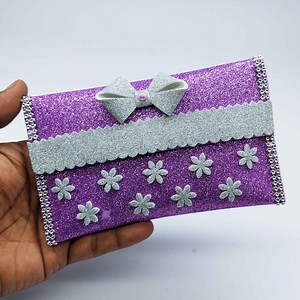 2.4K views · 124 reactions | Beautiful paper purse making very easy instruciton step by step at home  Amazing gift ideas with eva glitter foam paper purse  #purses #wallet #handbags | Origami Art & Crafts | Facebook
