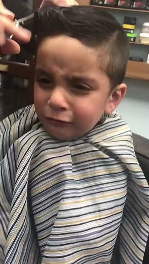 Cute Boy crying during haircut