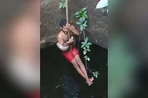 Man risks his life to rescue python from well
