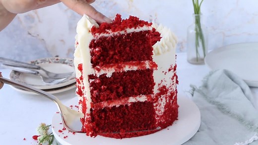 Red velvet cake isn’t just a chocolate cake with red food coloring added. In fact, the original red velvet cake got its name because the buttermilk and the vinegar naturally bring out the red undertones in the cocoa powder, giving the cake a red tint. Buttermilk and vinegar also break down the gluten in flour resulting in a more tender cake which is probably why it got the nickname red velvet. Of course over the years a little red food coloring was added to intensify the color to what we see tod