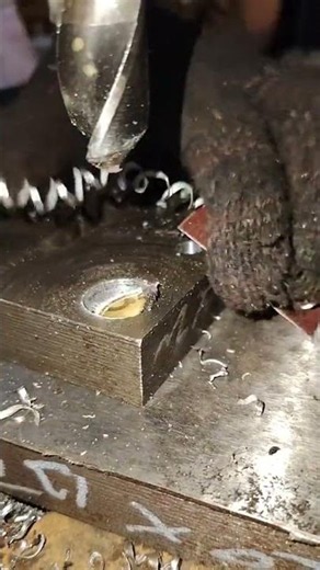 Does anyone know why sandpaper is used as a shim when drilling at the Level 8 machinist le