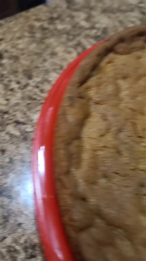 hoping they like it. it's a giant pumpkin chocolate chip cookie cake with cheesecake topping and colored white chocolate sburb logo #homestuck #homestuckfandom #fanart #fyf #custombirthdaycake