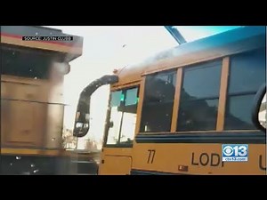 School Bus Gets Stuck Within Feet Of Passing Train