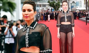 Noomi Rapace flashes her abs and toned legs in VERY racy mesh co-ord