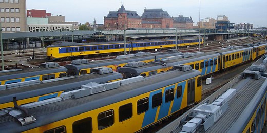 Solving the train unit shunting problem using multi-agent deep reinforcement learning with routing optimization