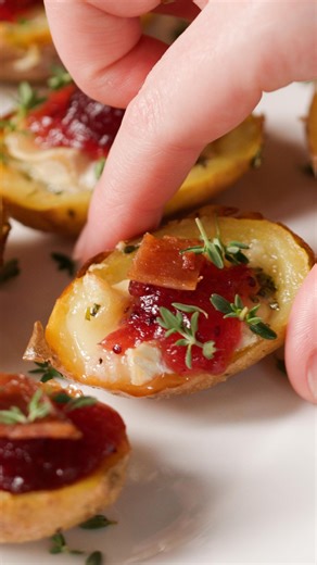 Cranberry brie crispy potato skins = the holiday bite of your dreams.@Ivskitchen Sponsored by Famous Idaho Potatoes Recipe below! #ad https://tasty.co/recipe/cranberry-brie-potato-skins | Tasty