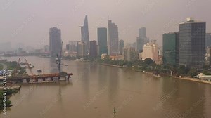 Aerial Vietnam Ho Chi Minh City Waterfront Downtown September 2019 Hazy Overcast Day 4K Mavic Pro Aerial video of downtown Ho Chi Minh City in Vietnam on a cloudy hazy overcast day.