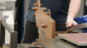 clip-3497369707-worker-using-metal-guillotine-shear-cutting-sheet