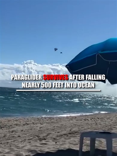 SCARY SIGHT: Heart-stopping video captures the moment a paraglider plunges nearly 500 feet into the ocean after a strong gust of wind. Authorities say the 52-year-old man did not suffer any major injuries from the frightening fall.