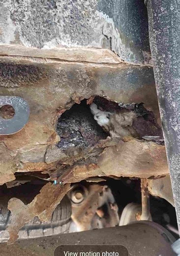 2011 Ford Escape, Rust and hole in rear frame