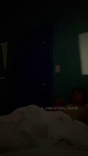relaxing bare in the dark room, he strokes deep and slow when his roommate enters and walks past. He continues gooning before panicking and trying to hide his throbbing cock under the sheets.