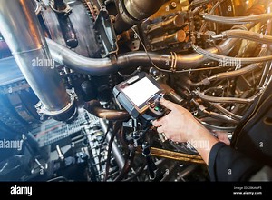 Inspection of a gas turbine engine using a Video Endoscope. Search for defects inside the turbine and shooting on video, photos using a measuring inst Stock Photo - Alamy