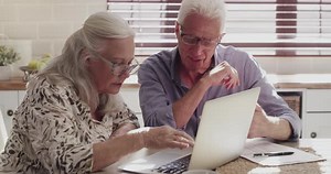 Senior couple, laptop and happy for home investment or budget planning, retirement