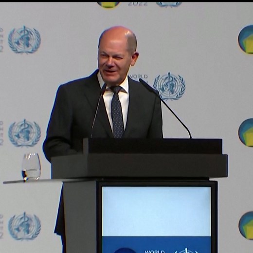 German climate activists set off a fire alarm to disrupt Chancellor Olaf Scholz's speech at the World Health Summit in Berlin. | DW News