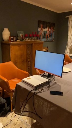 Indoor Gaming Setup with PlayStation 5 and Dining Area