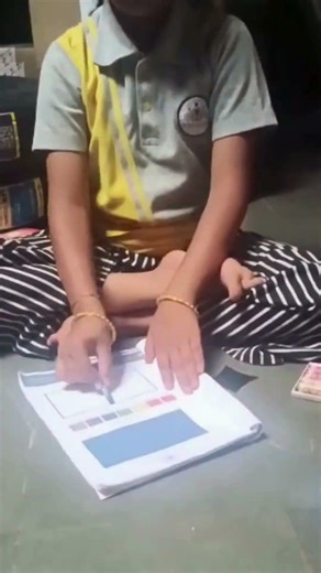 Vinuta Is Colouring With Her Eyes Closed.