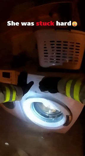 Firefighter saves a kitty from a wahing machine in a house with fire #shorts