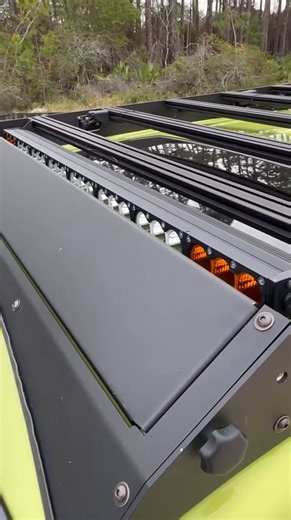 Our one-of-a-kind Adjustable LED Wind Deflector protects your LED light bar behind an adjustable fairing. When not in use you can raise it up in 30 seconds or less, keeping it street legal and reducing almost all wind noise from the rack while driving. | Cali Raised LED