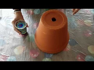 Pour onto terracotta pot with iridescent medium added with silicone