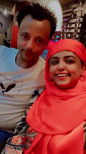 Fashion Analysis: White Eagle T-Shirt and Red Garment