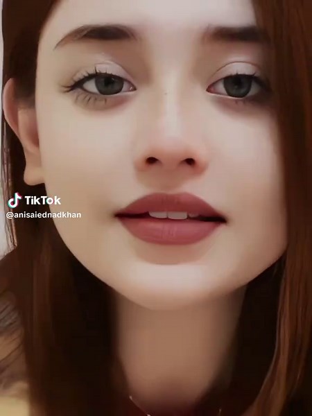 Close-Up Facial Features in Red Garment