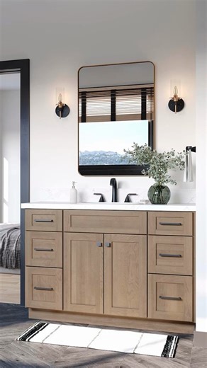 American Woodmark Cabinetry | This gorgeous Leesburg Maple Almond cabinetry is perfect for a bathroom that makes the most of natural wood tones. Watch how we created... | Instagram