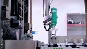 Pharmaceutical production line. Robotic arm of packaging machine at pharmaceutical plant. Industrial equipment. Automated process. Medicine industry. Medicine manufacturing line