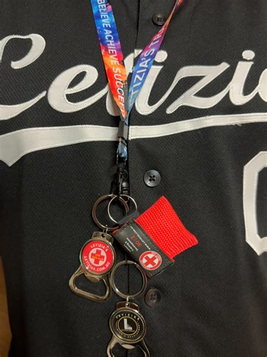 Wearing my lanyard with the 100% CPR keyring, 100% CPR badge, emergency CPR mask, and Letizia’s keyring — all proudly displayed with my Letizia’s shirt.  I wear my name and our merchandise with pride, because it’s my father’s name and legacy that started it all. None of this would be possible without Dad and Mum — everything we do is built on their hard work, love, and inspiration.  | Letizia's Training & Development | Facebook