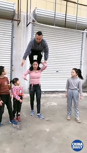 245K reactions · 136K shares | This mother a pillar of strength for her family — literally! #ChinaStory | China Daily | Facebook