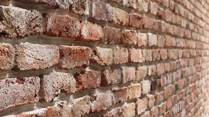Download Texture and details of a rustic brick wall in natural light for free