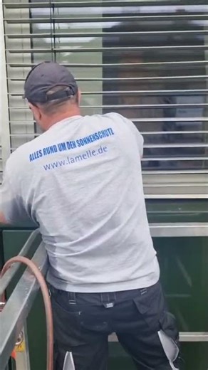 Washing blinds using a lift.