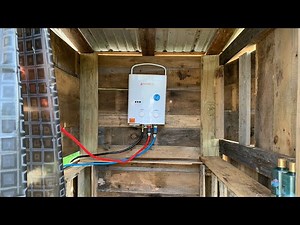 Off-Grid Outdoor Shower CAMPLUX Portable Hot Water Heater and Solar Panel Setup