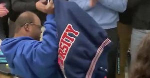 High school football team buys varsity jacket for special-needs student