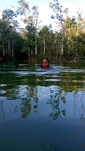 Enjoying Nature: Swimming in a Serene Forest Lake