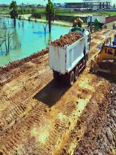 Heavy Work Scene!! Bulldozers Filling Pond with Dump Trucks #SoilFilling #PondRemoval #MitsubishiPower #ConstructionProject #DozerSkills #ConstructionMachinery #BulldozerAction #SitePreparation #HeavyMachineryWork #ExcavationWork #ConstructionLife #LandDevelopment #LandPreparation #Earthwork #PitFilling #HeavyEquipment #Earthmoving #MachinePower #LandfillProject #LandFilling #DozerLife #DumpingSoil #DumpTruck #IndustrialEquipment #TeamworkConstruction #MitsubishiDozer #DozerOperator | Bulldozer 