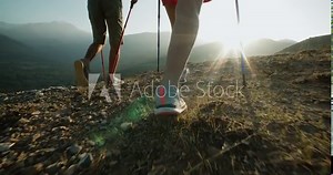 Hikers people hiking - healthy active lifestyle. Hiker people hiking in beautiful mountain nature landscape. Woman and man hikers walking during trekking hike.steadycam shot