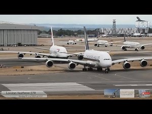 Close-up departures at London Heathrow Airport, rwy 27R Ft Double stack A380 departure at 01:24:30