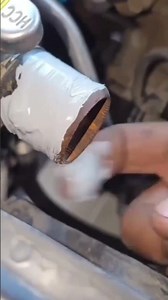 applying glue to the car radiator hose connection