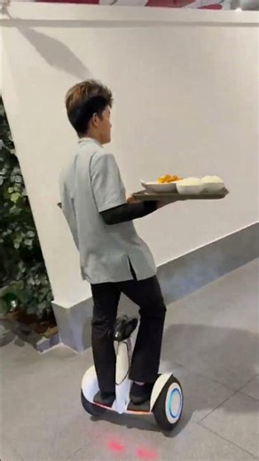🍽️ Restaurant Waiter Riding a Segway! 😲🚀 Speedy Waiter Delivers Food Like a Pro!🤖 Future of Rest