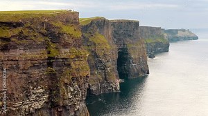 CLIFFS OF MOHER, IRELAND. Real-time footage of the breathtaking landscape along the wild Atlantic Way. Panoramic view of the cliffed coast with the rugged coastline