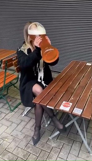 Lady downs huge beer