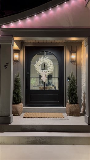 Bethany Sinks on Instagram: "After all the sparkle and celebration, I always find myself craving simplicity. A quieter porch, softer layers, and a fresh start for a brand new year. January reminds me that less can still feel full. *NO SLIPPERS AND SOCKS WERE HARMED IN THIS REFRESH 🎤😜😂 #winterdecor #porchdecor #januarystyle #winterwreath #winterwhite front porch winter wreath porch appeal porch refresh"