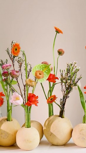 Interflora India on Instagram: "Sustainable Summer | Part 2 Bringing a fresh, sophisticated touch to your summer setting with orchids, tulips, roses, mini gerberas, statice, and helichrysum—each artfully arranged in musk melon vases. #interfloraindia #sustainablesummer #DIYflorals #UniqueArrangements #Summer"